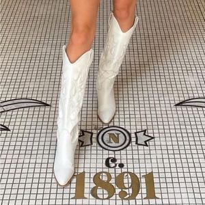 White tall cowboy boots